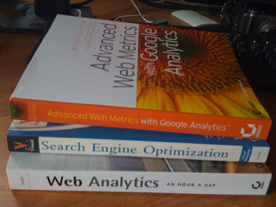 screen shot of a stack of books about google analytics and search engine optimization